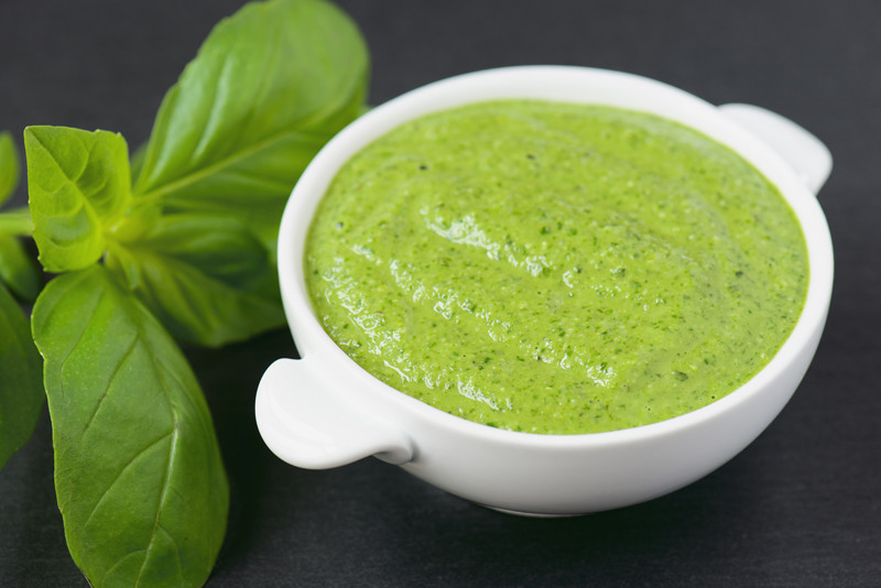 Close-up of while bowl of freshly made pesto sauce