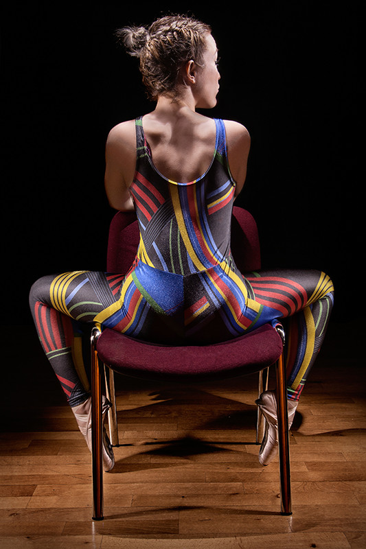 Light painting of dancer sitting down on a chair at Dance Base studios, Edinburgh