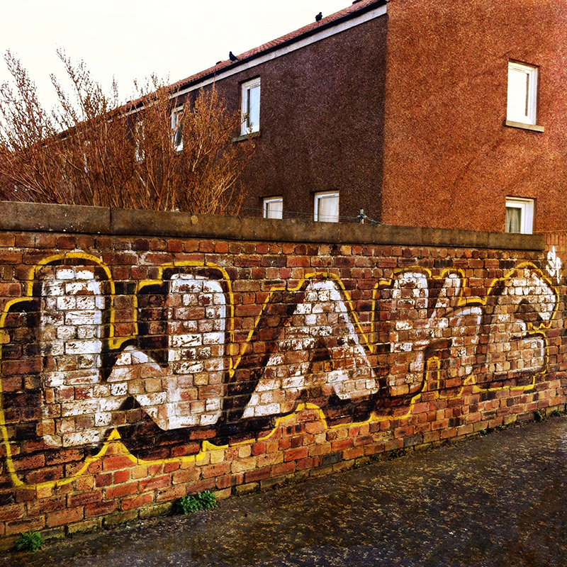 Urban graffiti in Portobello, Edinburgh. Edited with Chrome filter from Camera+.
