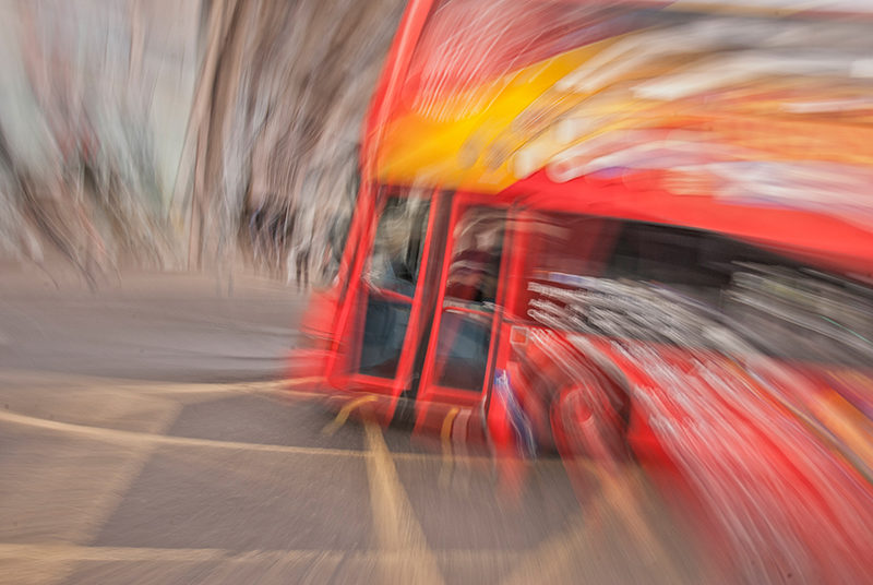 Edinburgh tour bus, impressionist photography using zooming and camera rotation