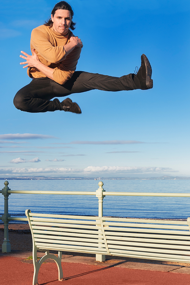 Dancer Paul Distefano jumping from a bench in Portobello