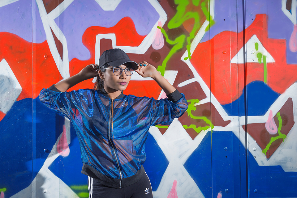 Hip Hop dancer Savitha Devi in front of graffiti wall
