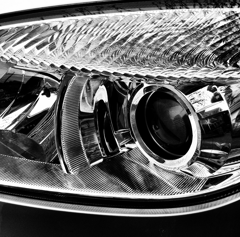 Black & white photograph of car headlight
