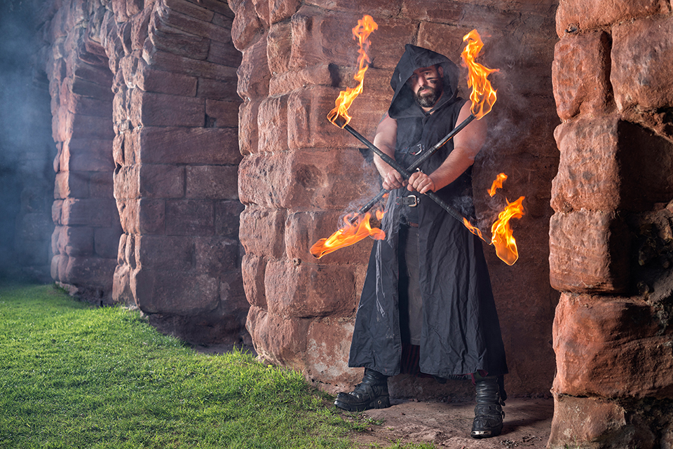 Ron in black outfit handling fire at Roslin Castle