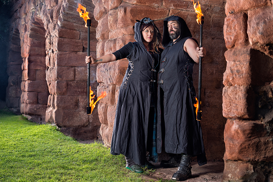 Ron and Jess in black outfit handling fire at Roslin Castle