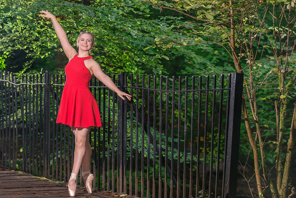 Dancer in red dress in the forest