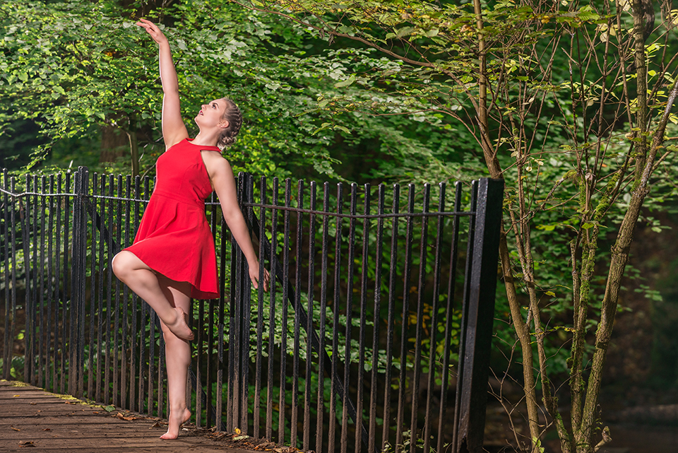 Dancer in red dress in the forest