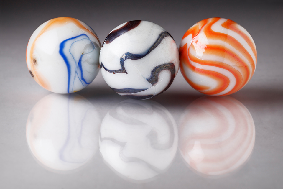 Coloured marbles with reflections