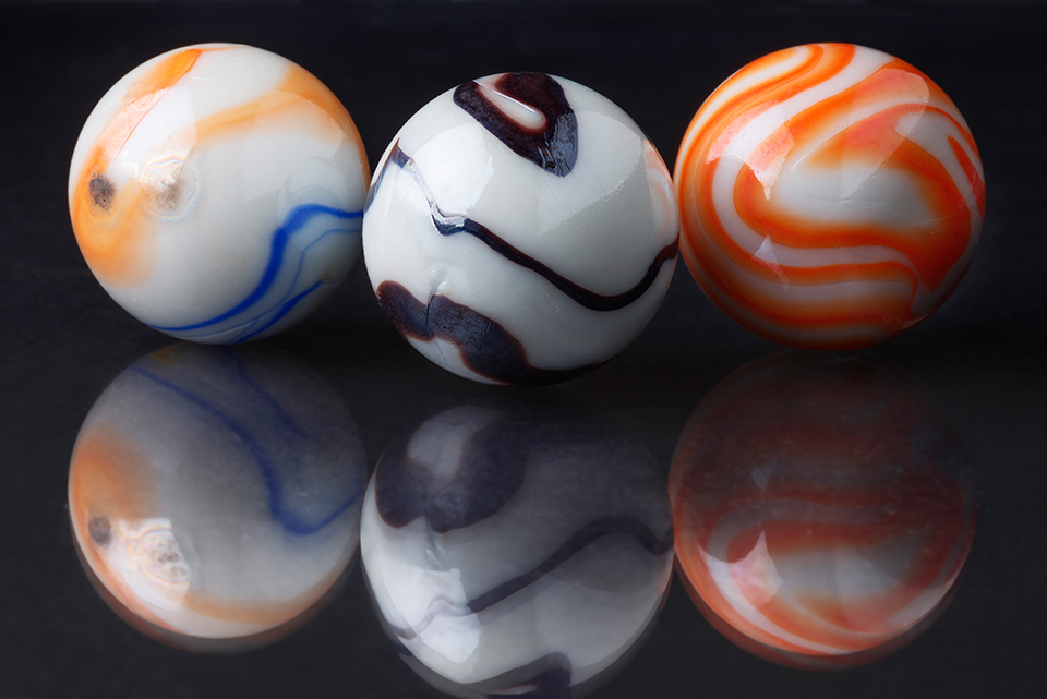 Black and white and coloured marbles
