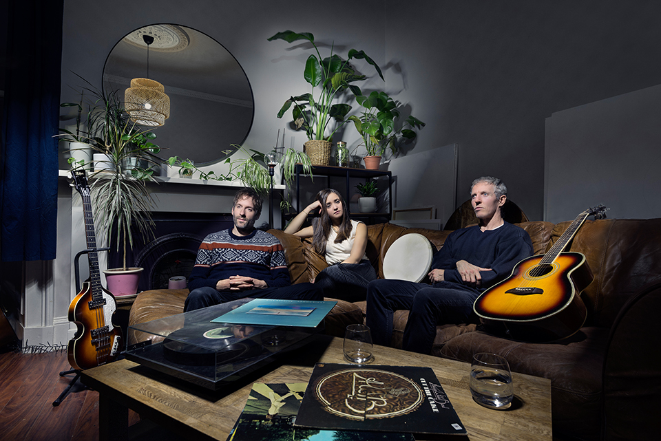 Light painting of three piece band Navali in a living room