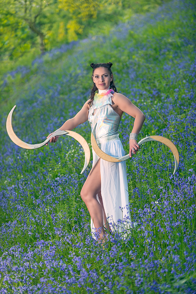 Circus artist Jusztina Hermann in a field of bluebells