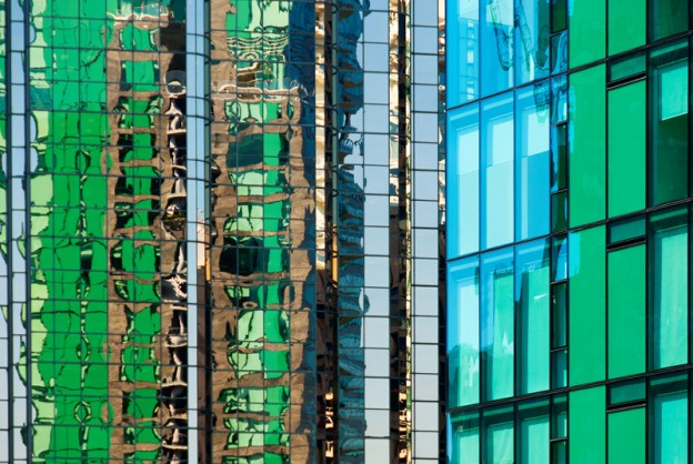 Combining a green tower in Vancouver, B.C. and it's reflection in the nearby building with the use of a telephoto lens.