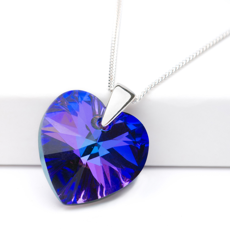 Jewellery product shot. Deep blue coloured pendant designed by Candle Jewellery.