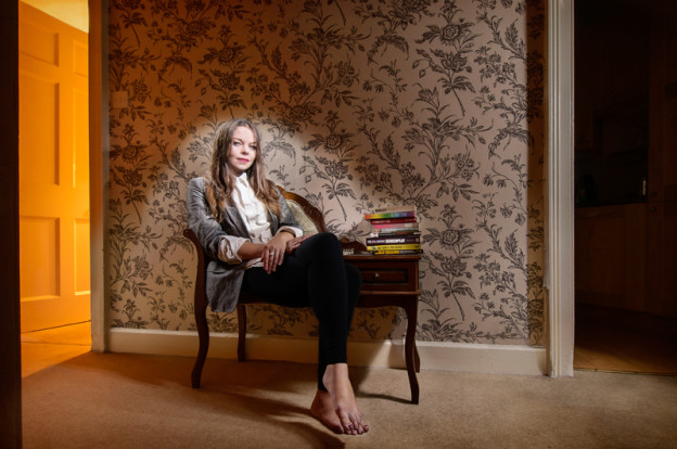 Light painting of actress, writer and performer Juliette Burton in her Edinburgh flat, sitting in a chair