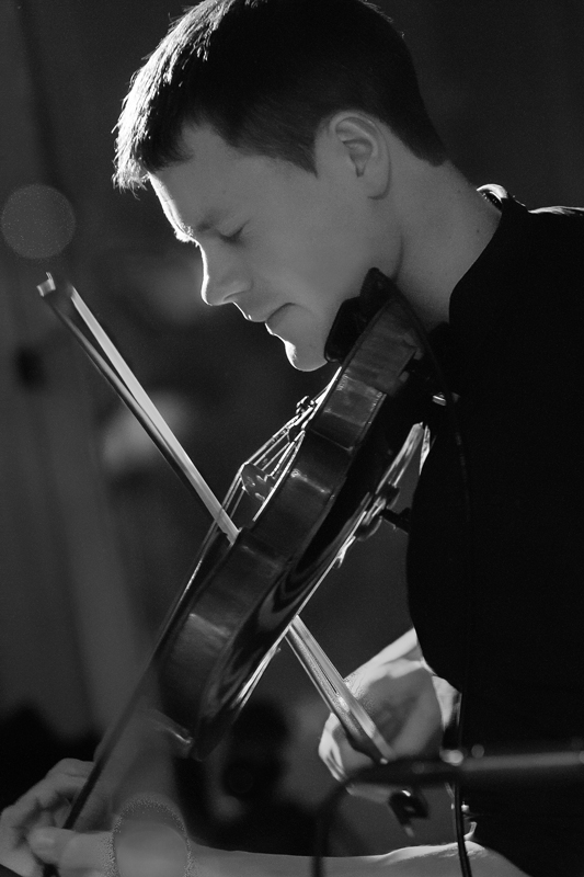 Michael Haywood playing the violin at ceilidh event in Summerhall, Edinburgh, with the band Hotscotch