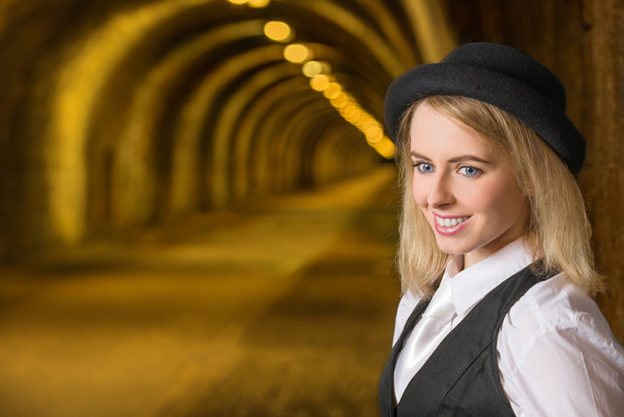 Smiling model with Innocent Railway Tunnel, Edinburgh as background