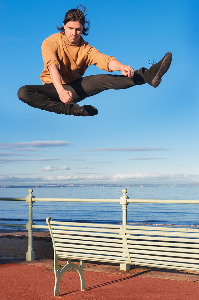 Dancer Paul Distefano jumping from a bench in Portobello